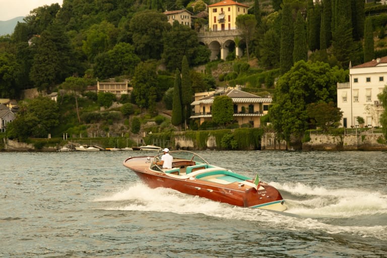 The Aquarama passing a lakeside villa