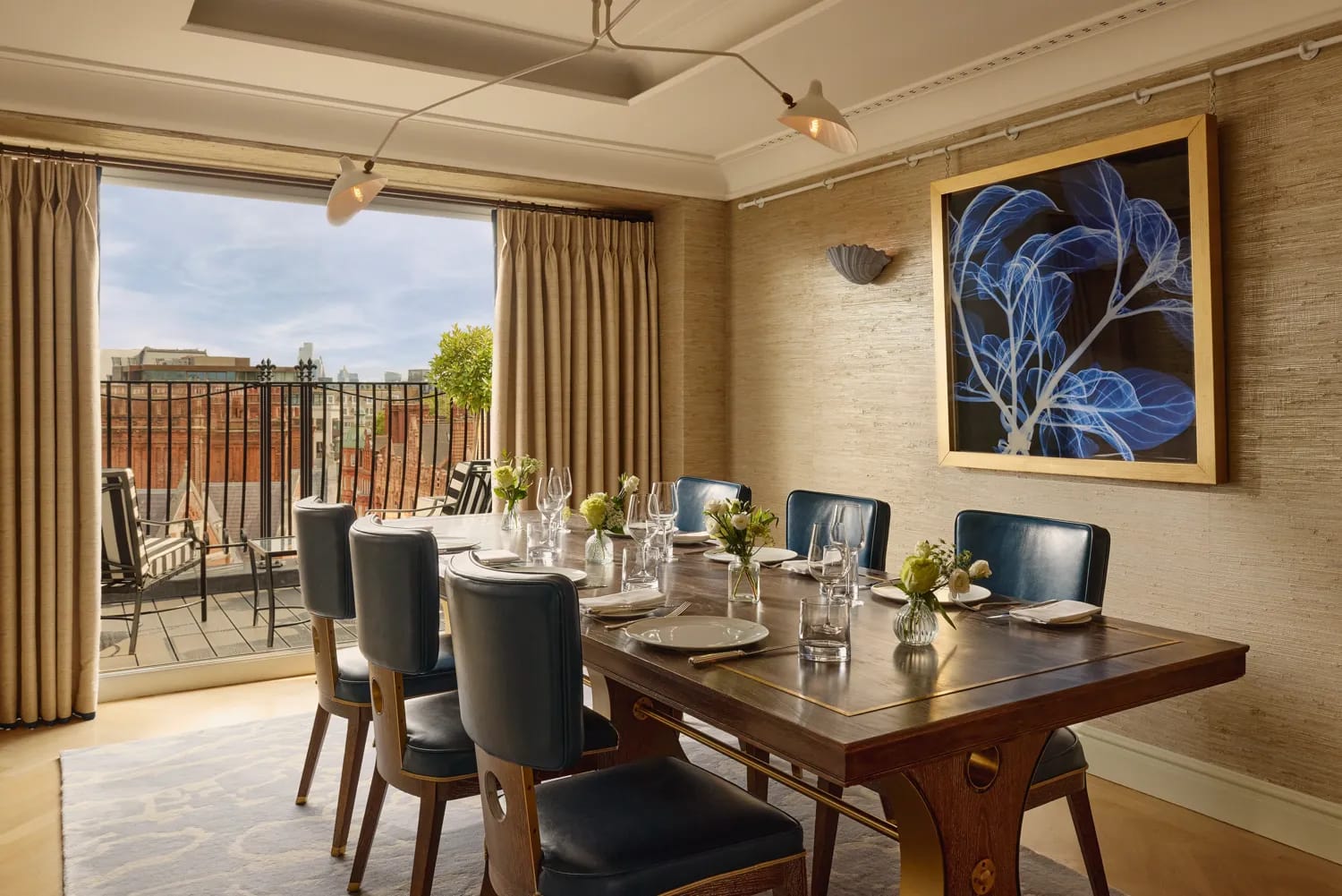 The dining room for eight, opening to a balcony