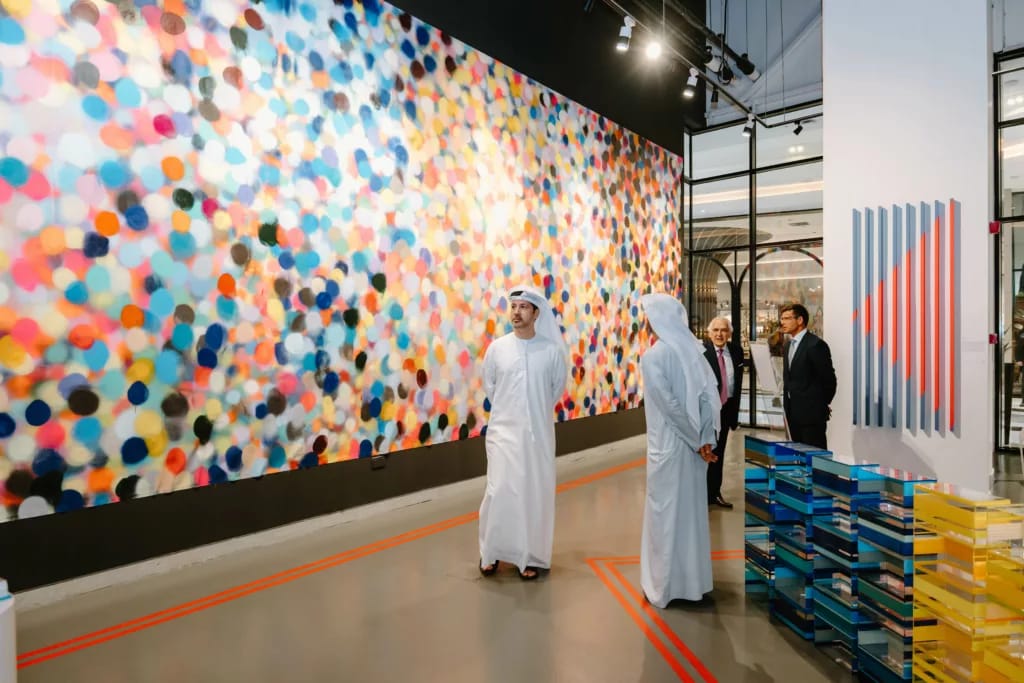 The painted wall and mirrored sculptures