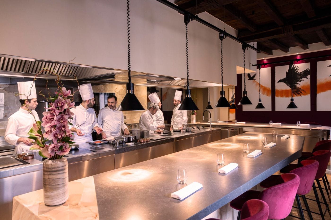 A chef's table facing the brigade