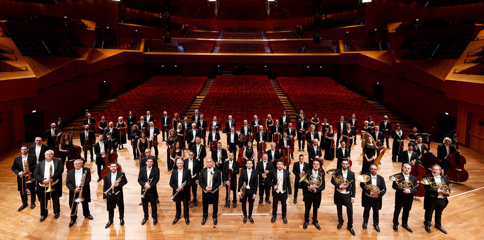 The Santa Cecilia orchestra on the stage of Sala Santa Cecilia