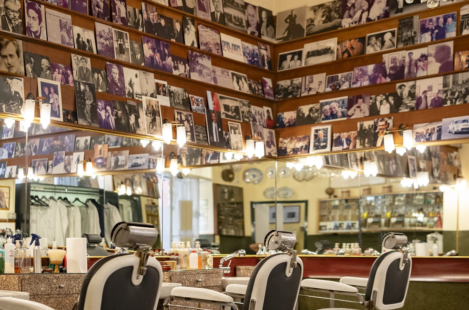 The chairs under the wall of photographs