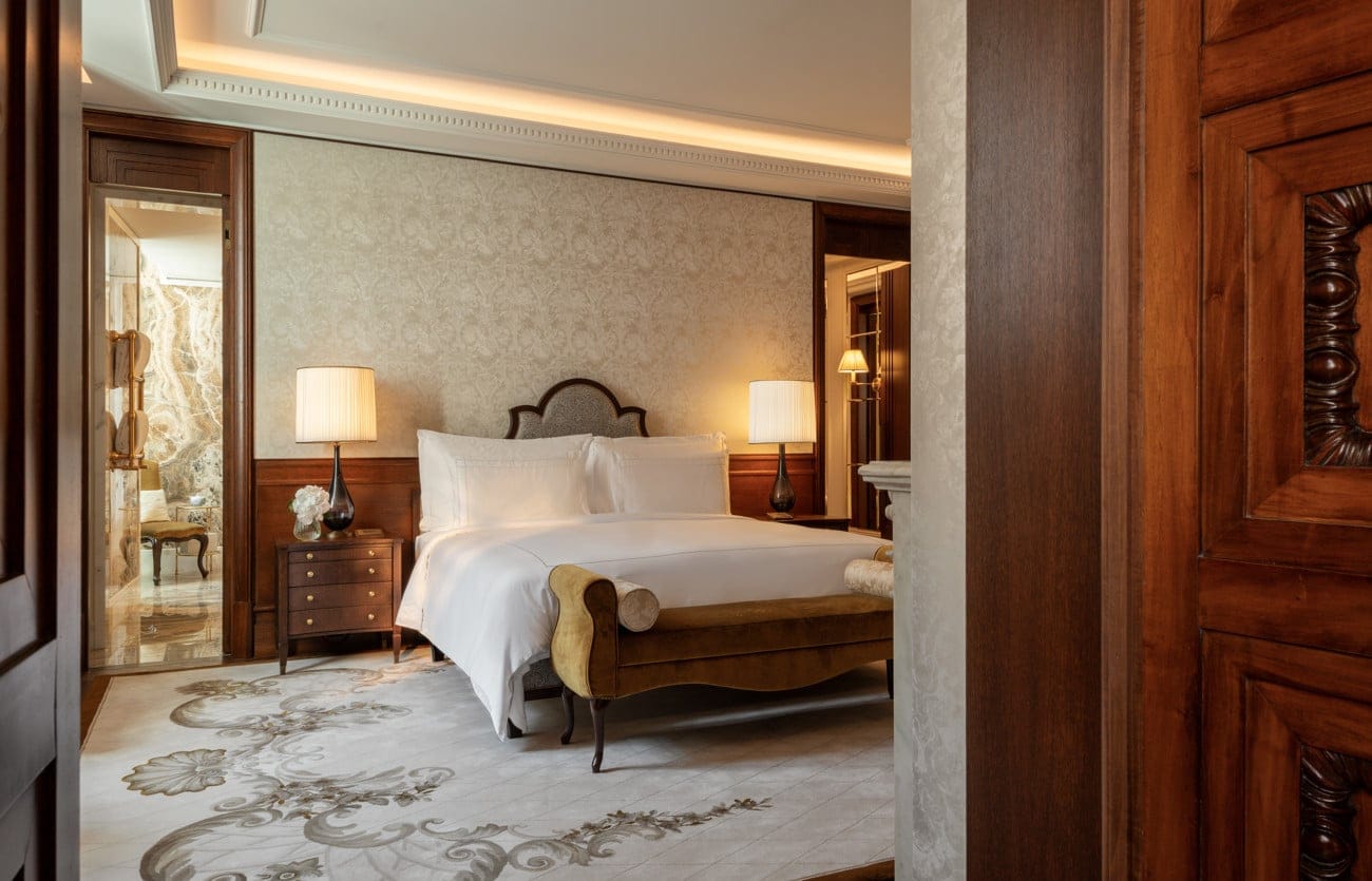 The bedroom and marble bathroom