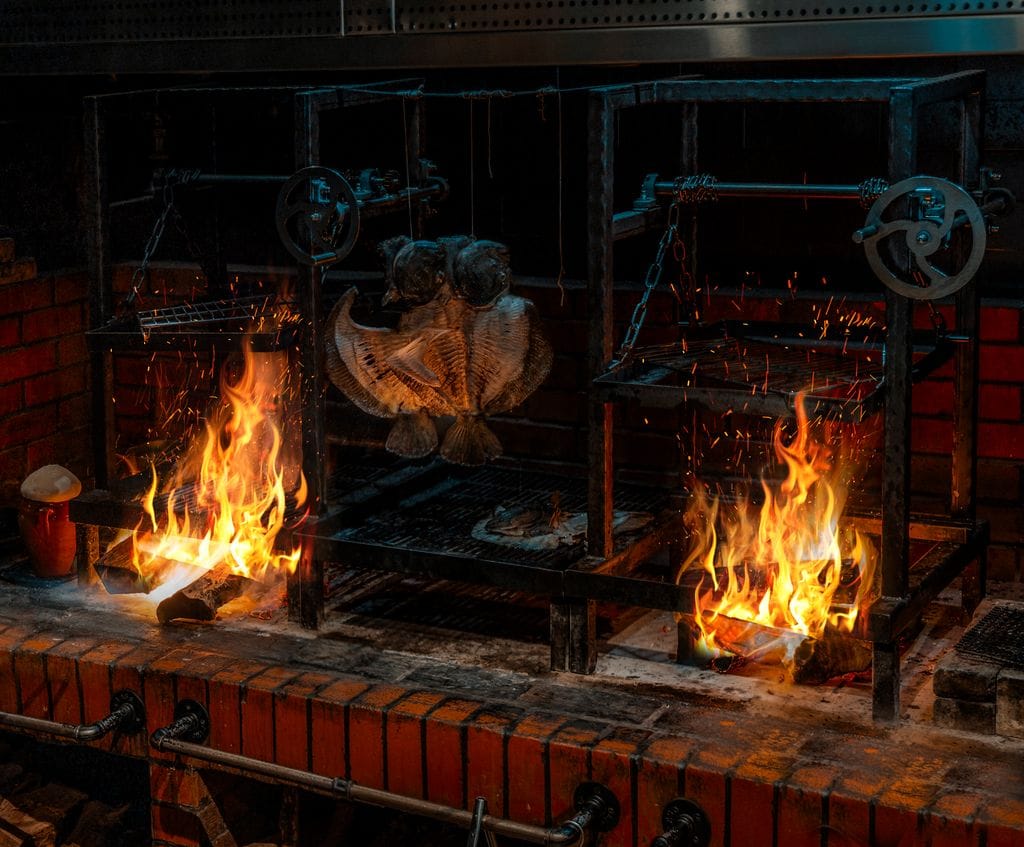 The wood-fire grill in the open kitchen