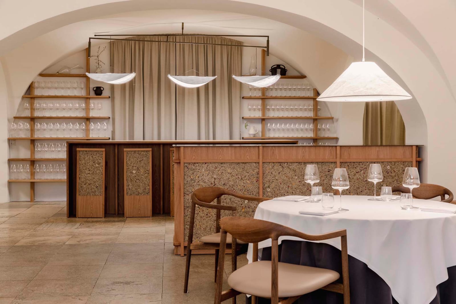 The vaulted dining room and wine wall