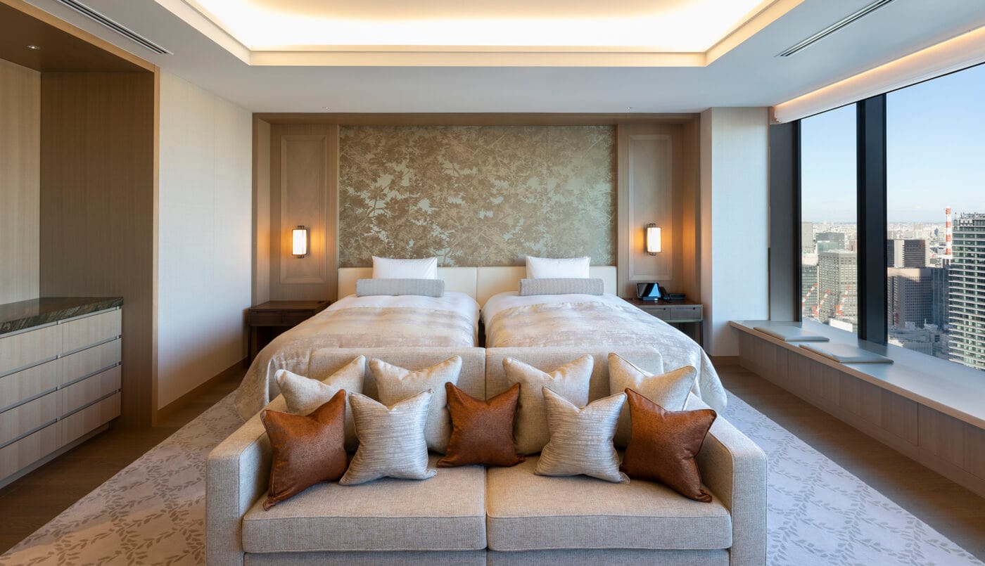 A twin bedroom over the city