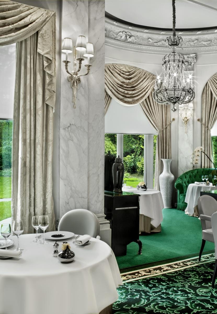 Tables by the windows onto the garden