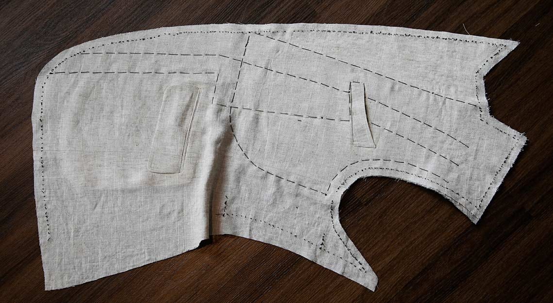A jacket forepart basted for a fitting
