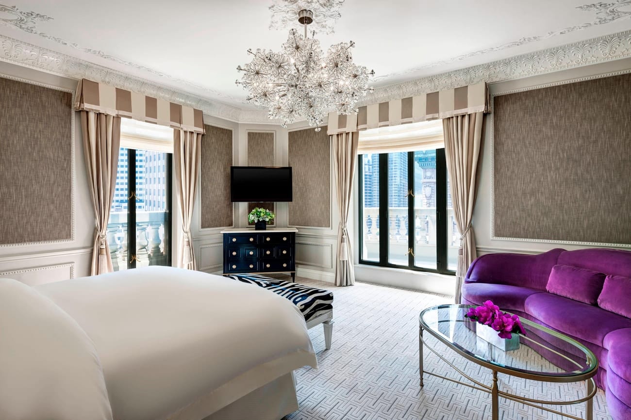 A bedroom with windows on two sides