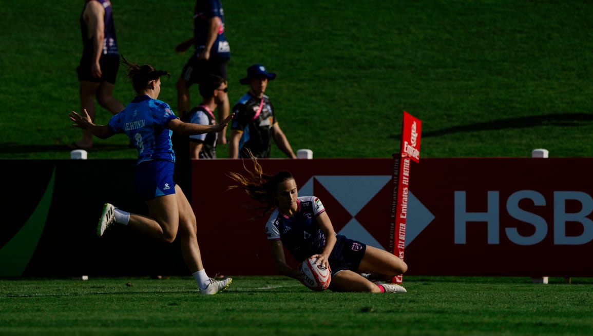 A try scored in front of the pitchside boards
