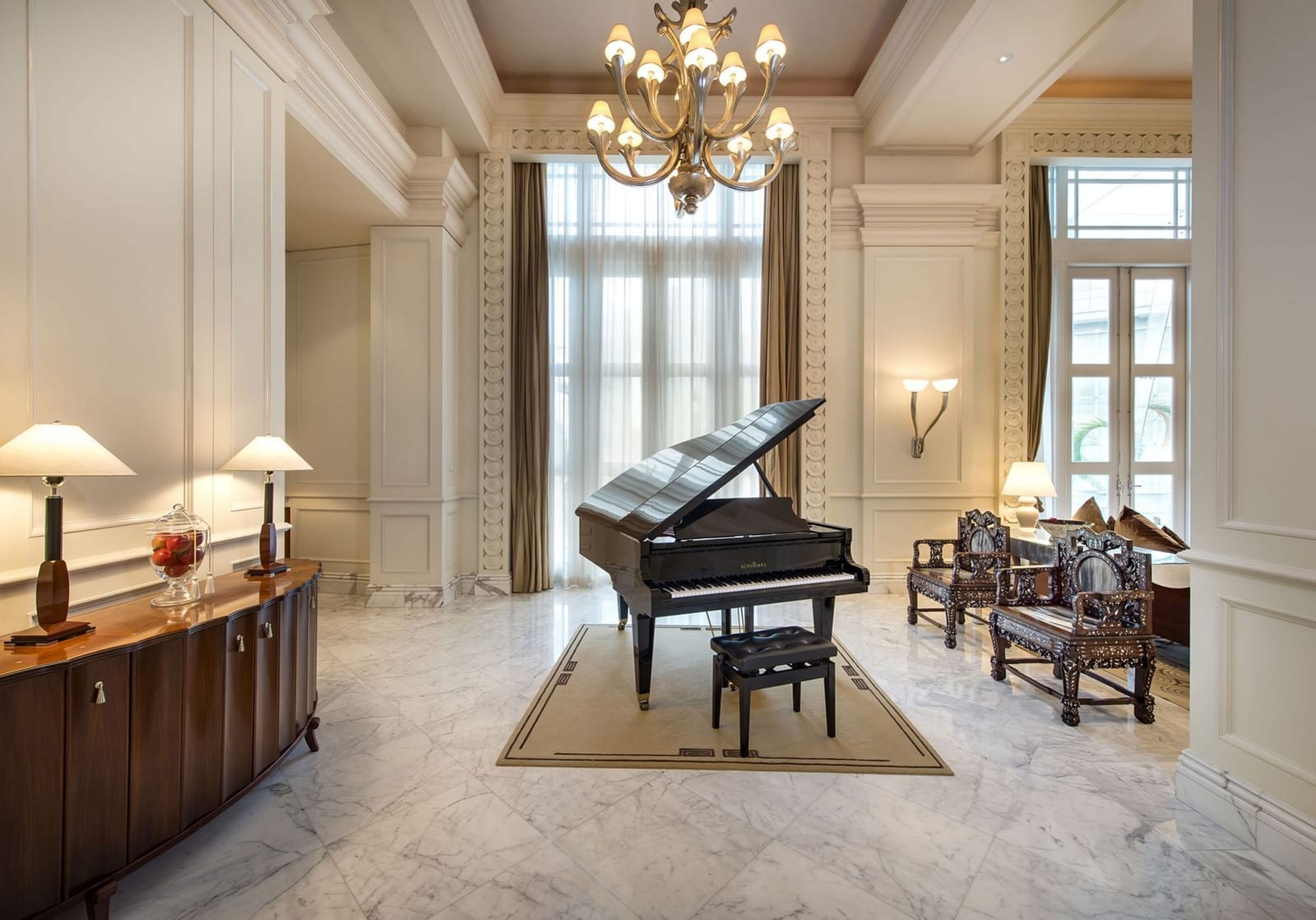 The living room with baby grand piano