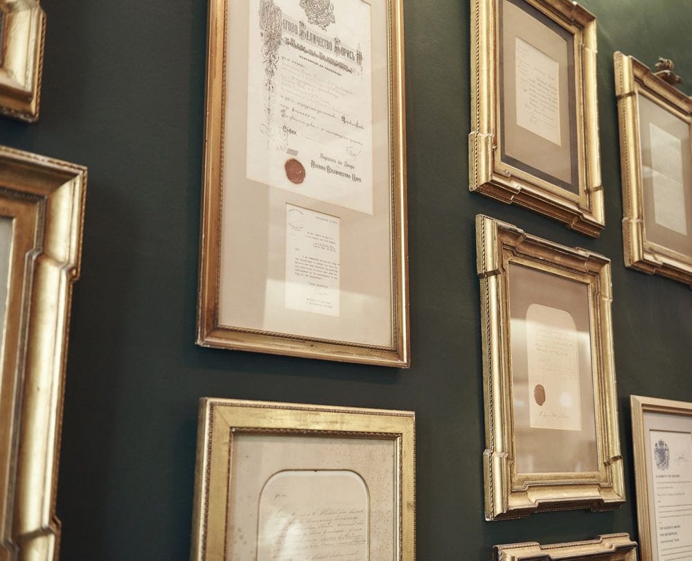 Royal warrants on the showroom wall