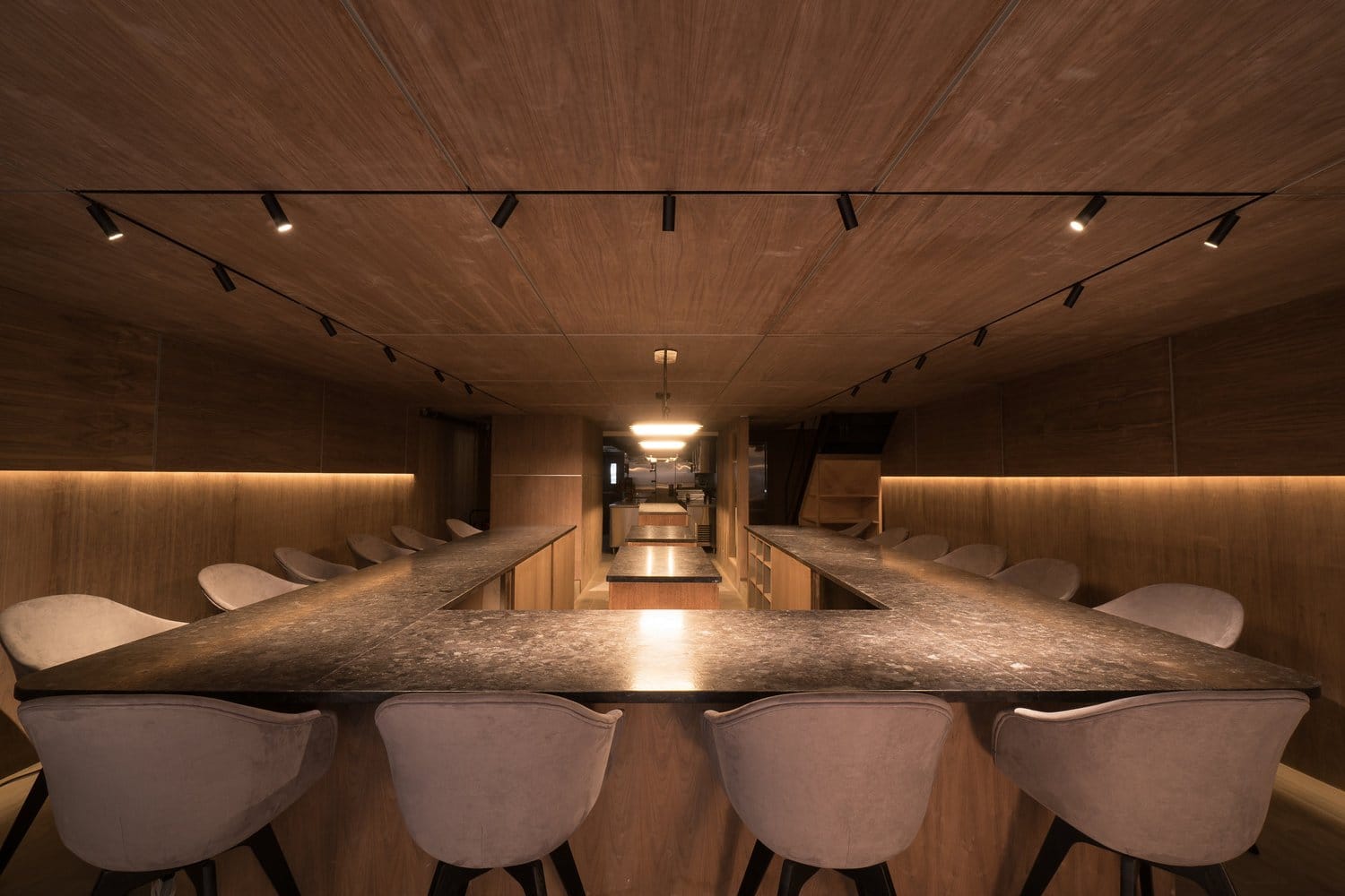 The U-shaped counter and open kitchen