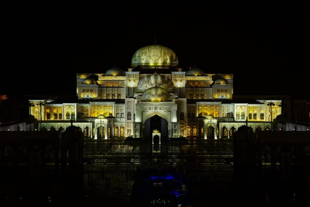 The facade lit at night