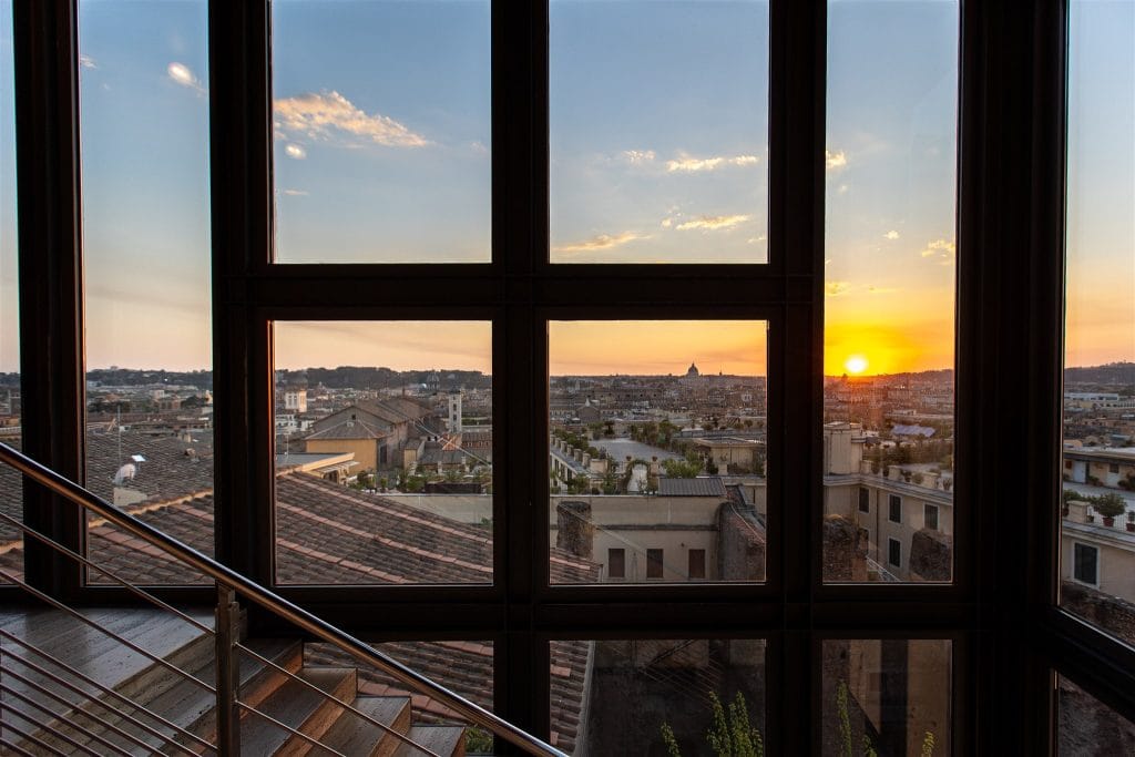 The staircase window over the rooftops towards St Peter's