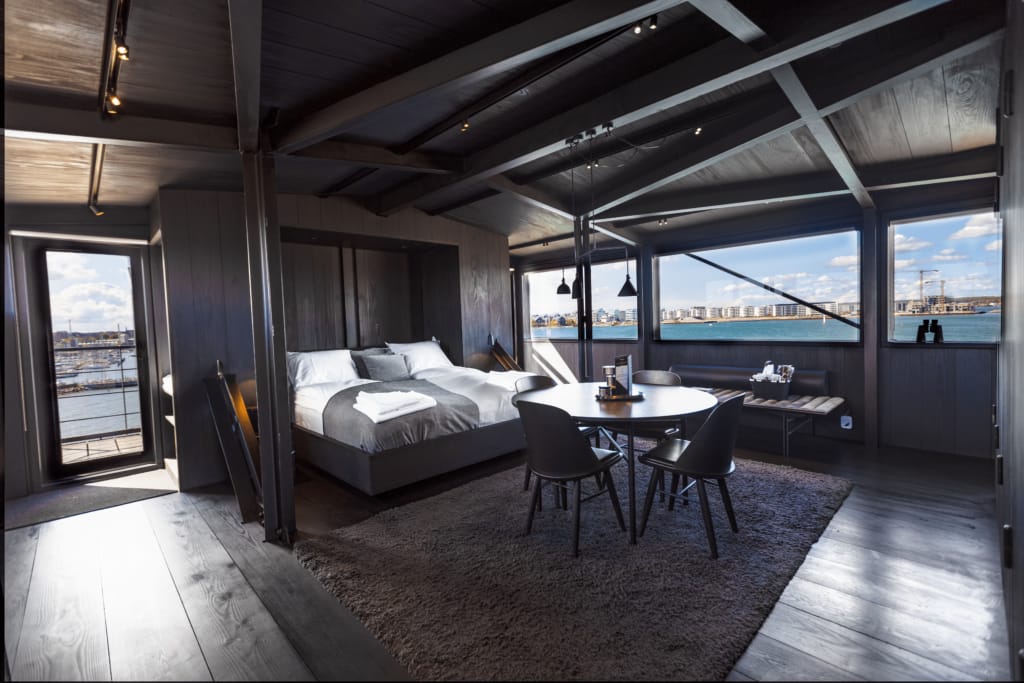 The room, with the harbour beyond the windows