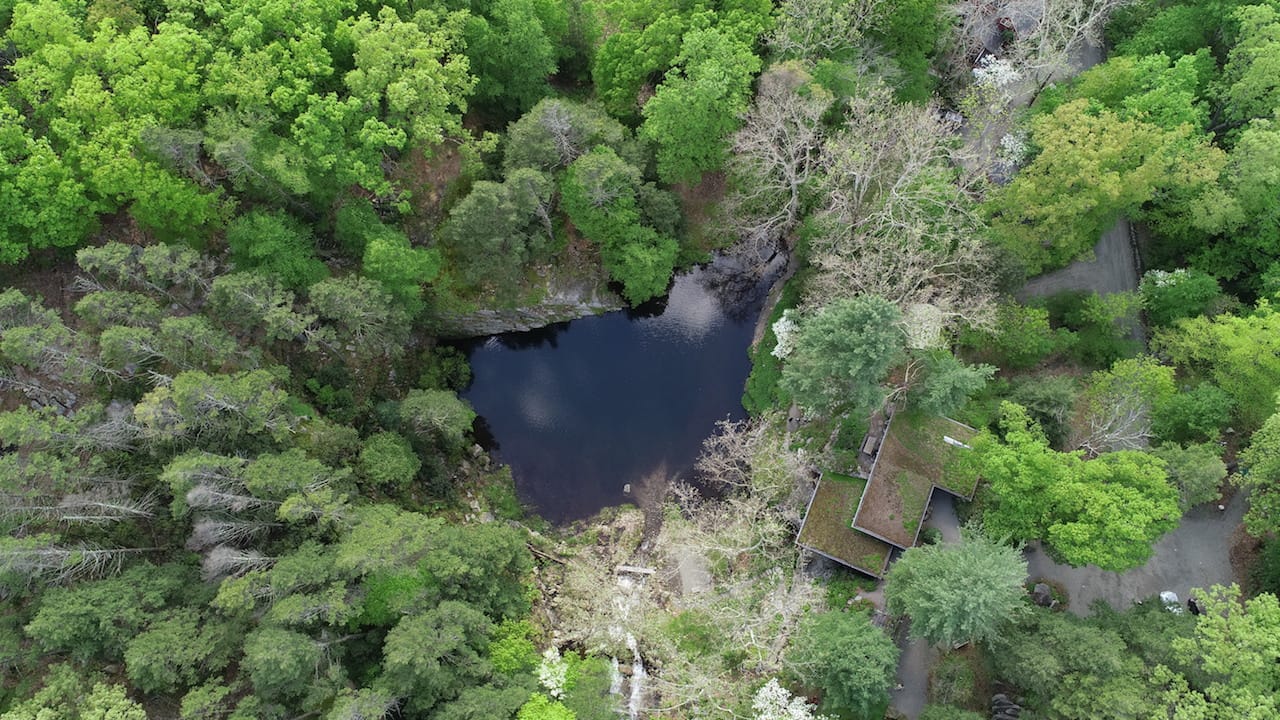 The quarry pool and the house from above