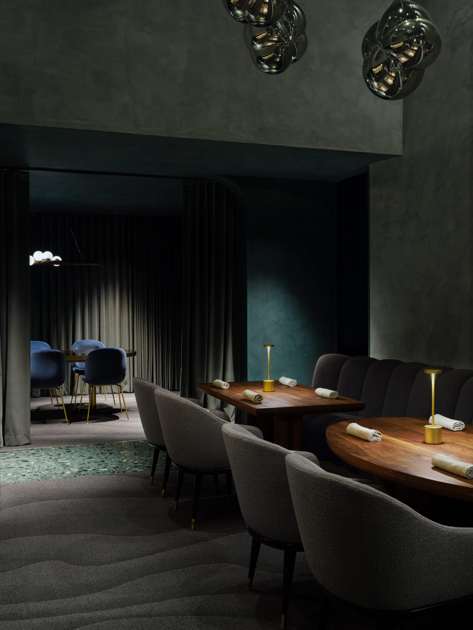Banquettes and the curtained room beyond