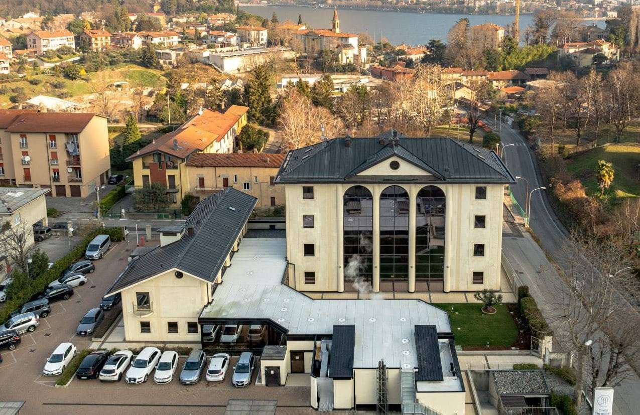 The clinic from above, by the lake