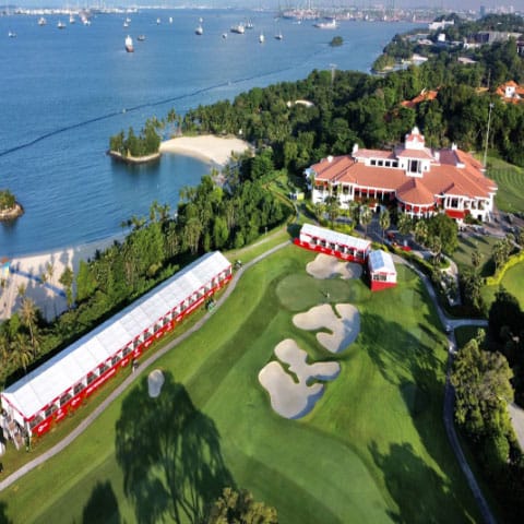 The clubhouse above the course and the strait