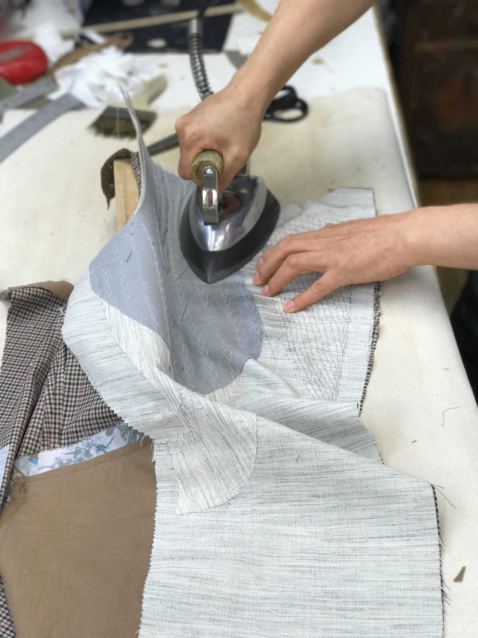 Pressing canvas in the workroom