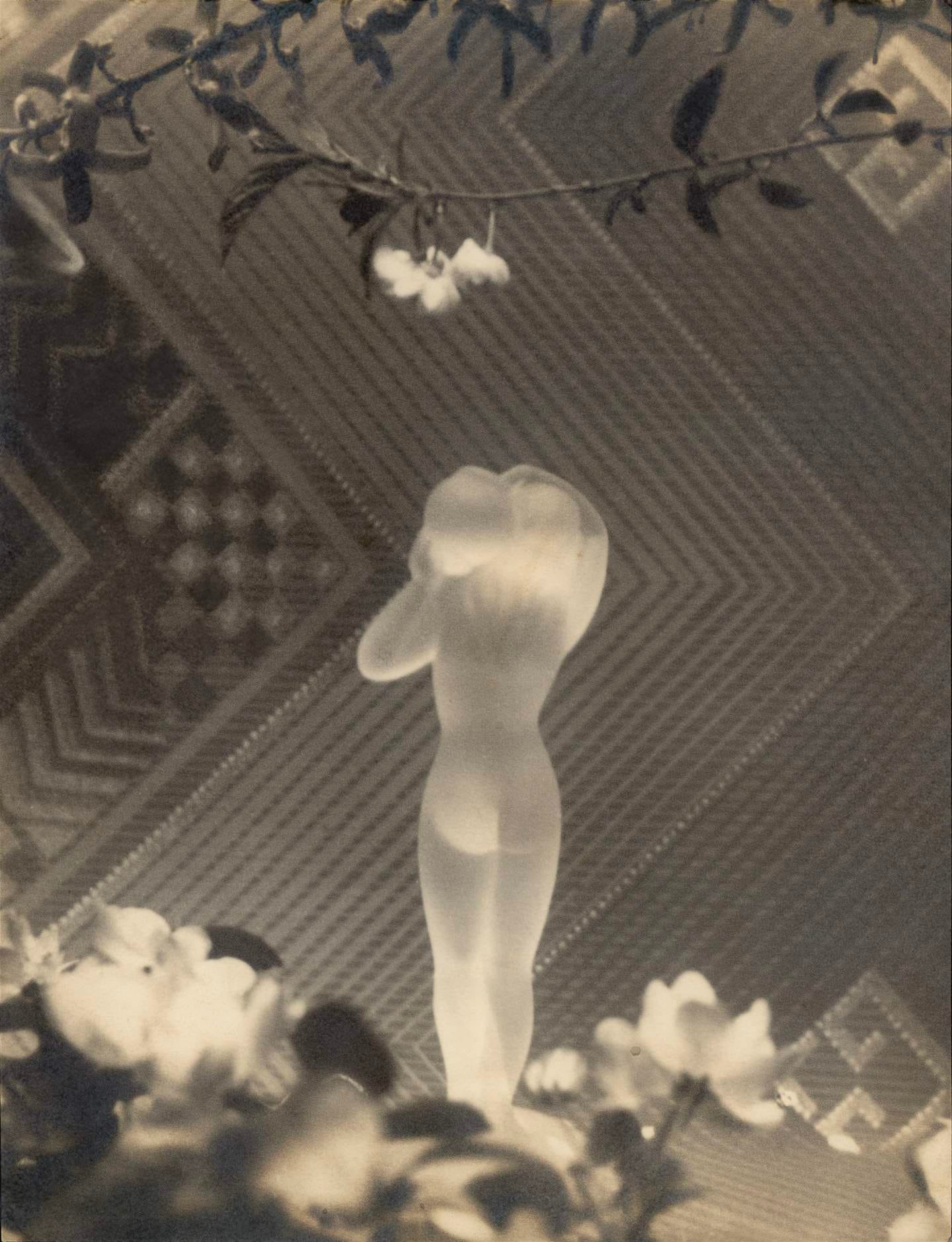 A glass figure among blossom, a print in the exhibition
