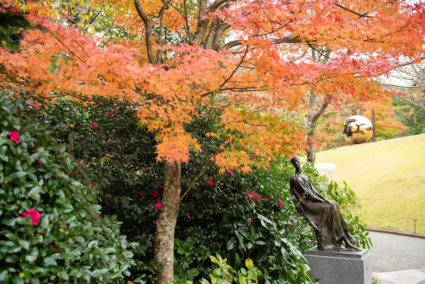 Maples and a bronze figure in autumn